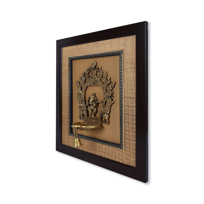 Brass Dancing Ganesh Murti With Diya Framed On Raw Silk Photo Frame - 18 x 15.5 Inches | Ganpati Picture Frame - Hindu God Photos & Frames