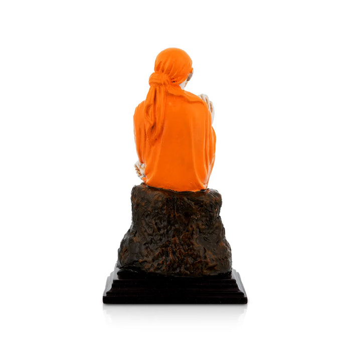 Saibaba Statue - 5 x 2.7 Inches | Saffron Finish Saibaba Idol / Saibaba Sitting Murti/ Shirdi Sai Baba Vigraham - Fibre Murties